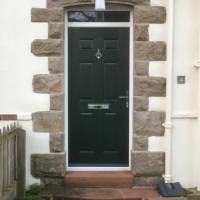 Green Composite door - Carlton solid with White PVC outer frame