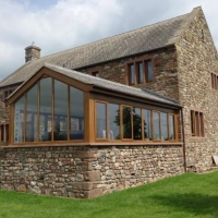 Oak PVC conservatory frames on traditional slate roof conservatory 