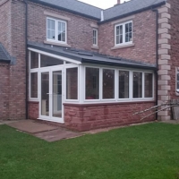 Warm Tiled Roof Conservatory with White PVC frames