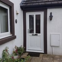 White PVC door with RBD 35 bevelled glass & concaved panel bottom
