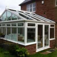 White PVC Gable style conservatory with glass roof